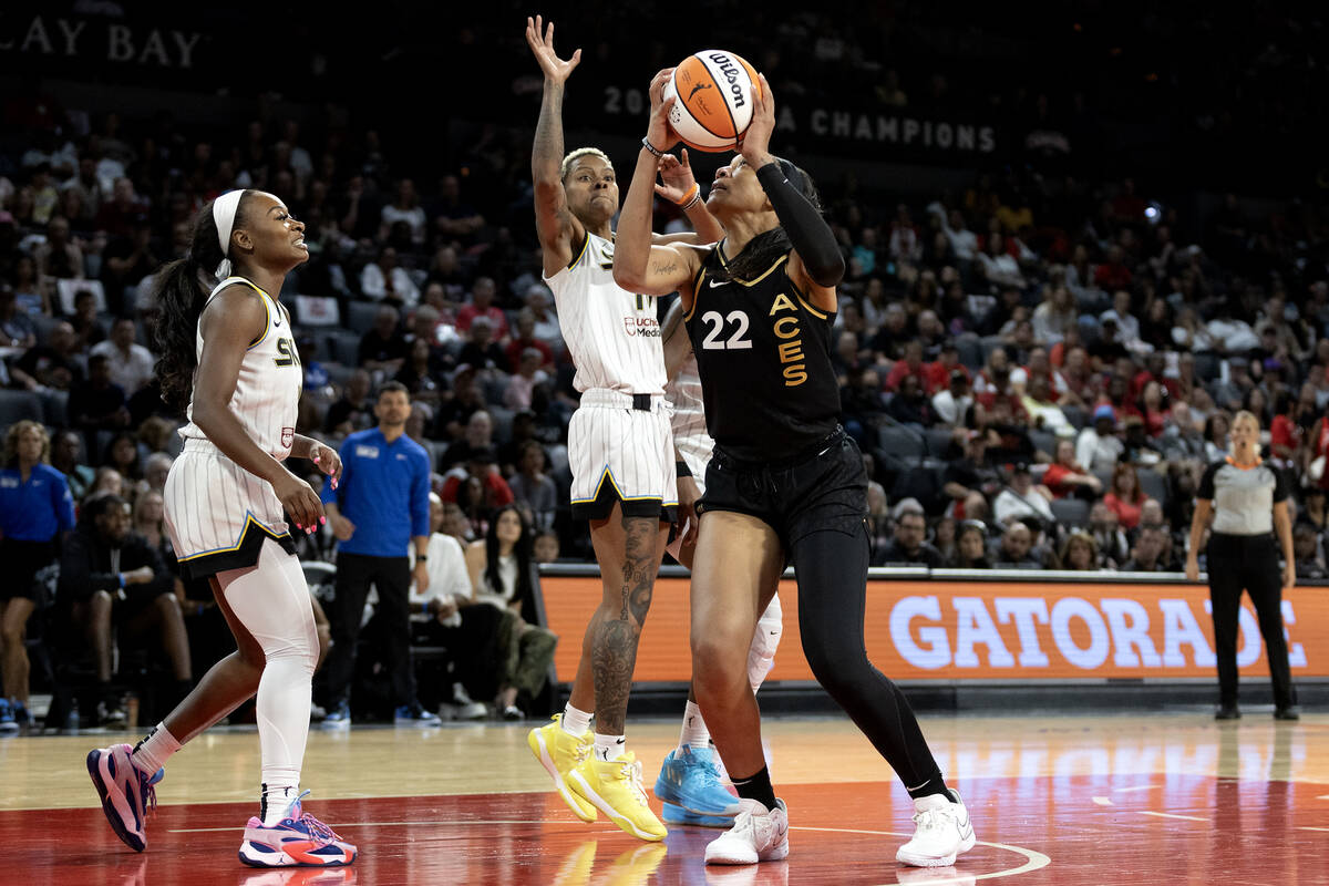 Las Vegas Aces forward A'ja Wilson (22) attempts to shoot while Las Vegas Aces guard Kelsey Plu ...