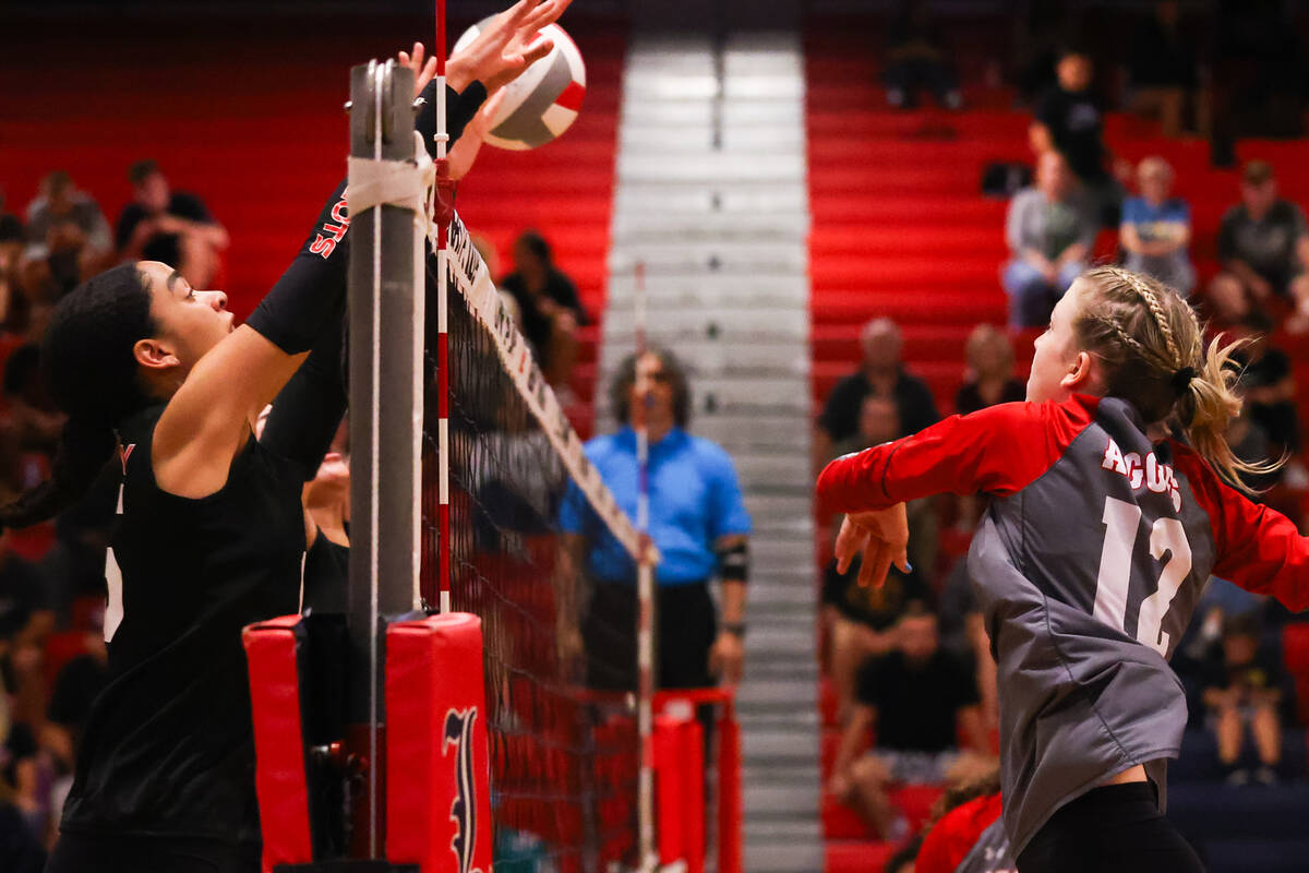Arbor View’s Cori Leavitt (12) hits the ball past a Liberty player during a volleyball g ...