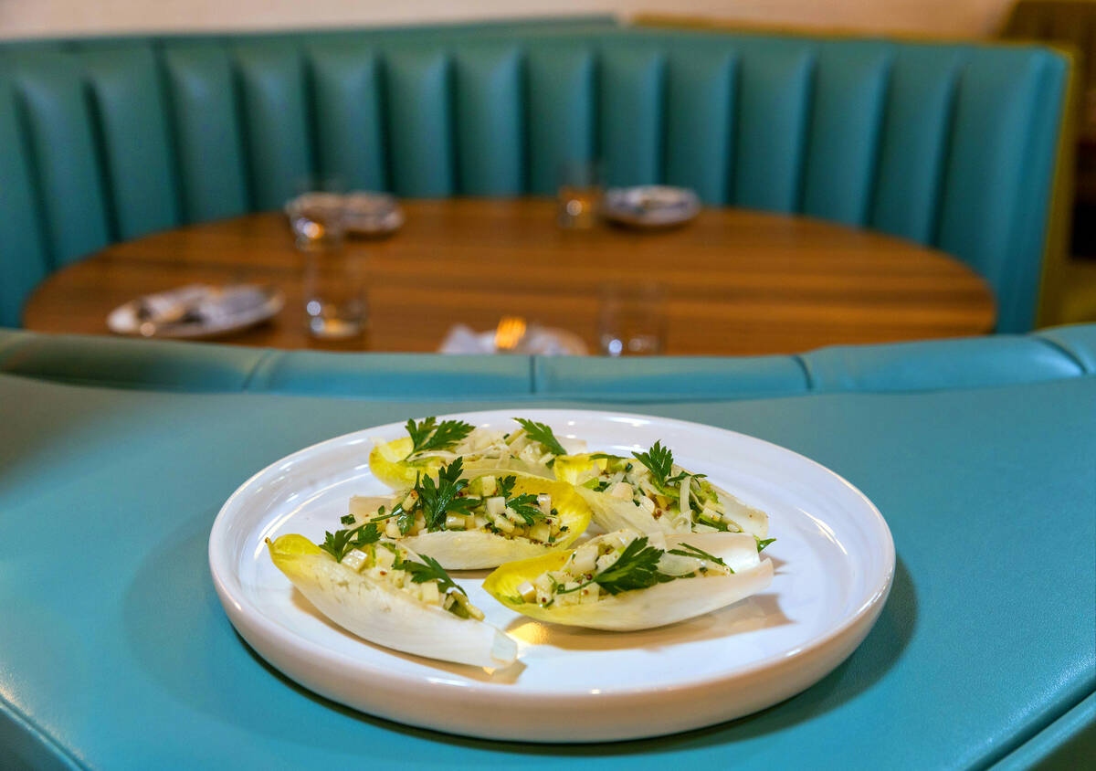 Endive cups filled with hearts of palm, celery, fennel and mustard are prepared at Main St. Pro ...