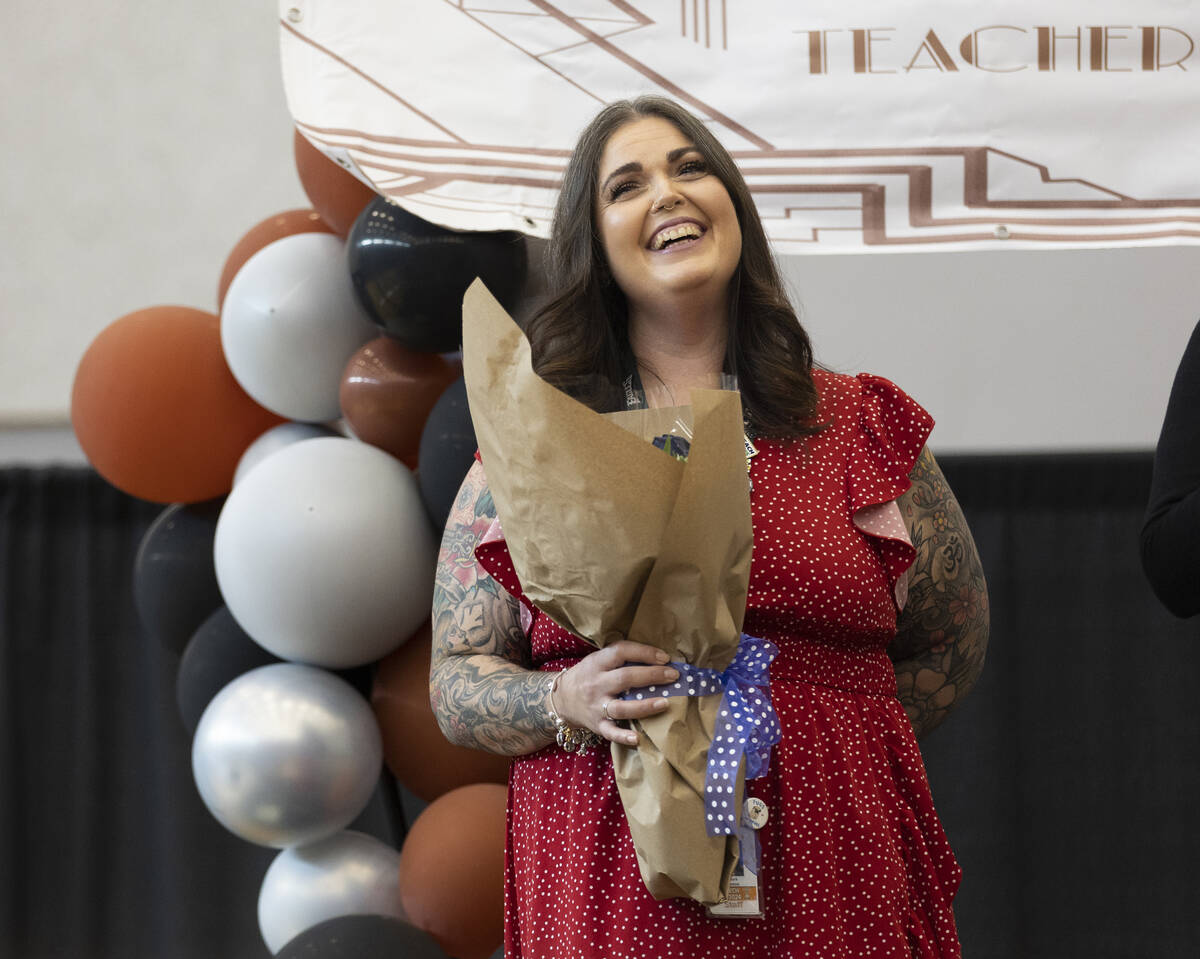 Laura Penrod, an english teacher at Southwest Career and Technical Academy, reacts after winnin ...