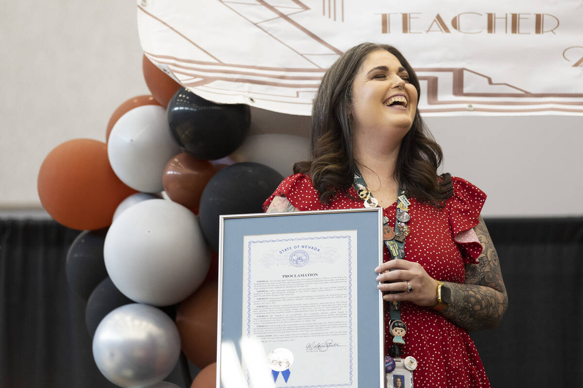 Laura Penrod, an english teacher at Southwest Career and Technical Academy, reacts after winnin ...