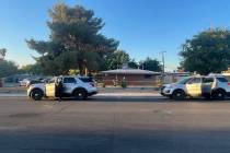 Crime scene investigators for the Metropolitan Police Department investigate a homicide Friday, ...