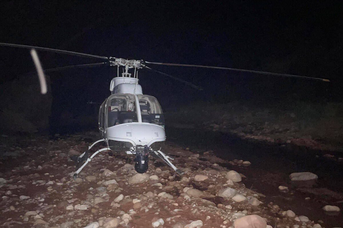 An Arizona Department of Public Safety Western Air Rescue helicopter lands near the Kanab Creek ...