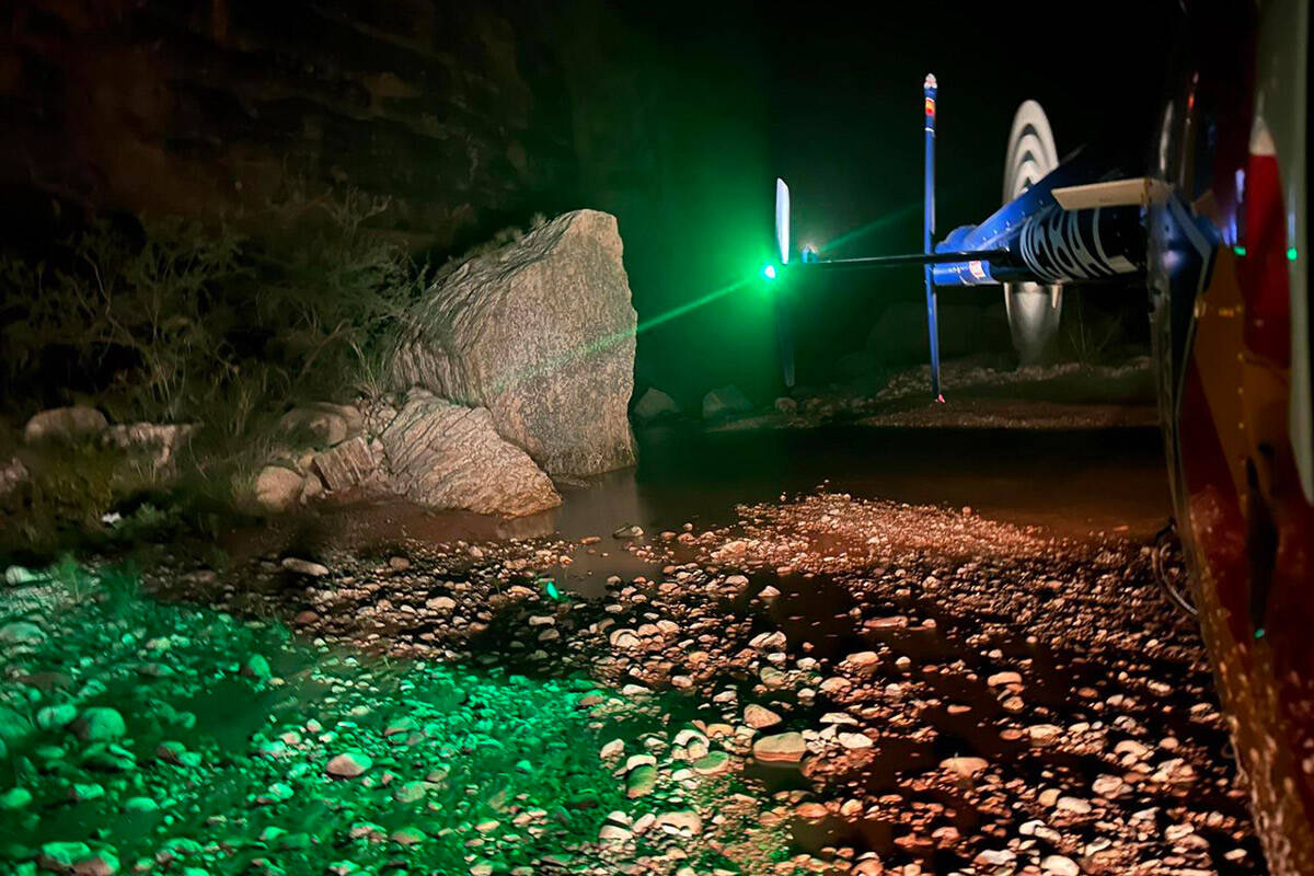 An Arizona Department of Public Safety Western Air Rescue helicopter lands near the Kanab Creek ...