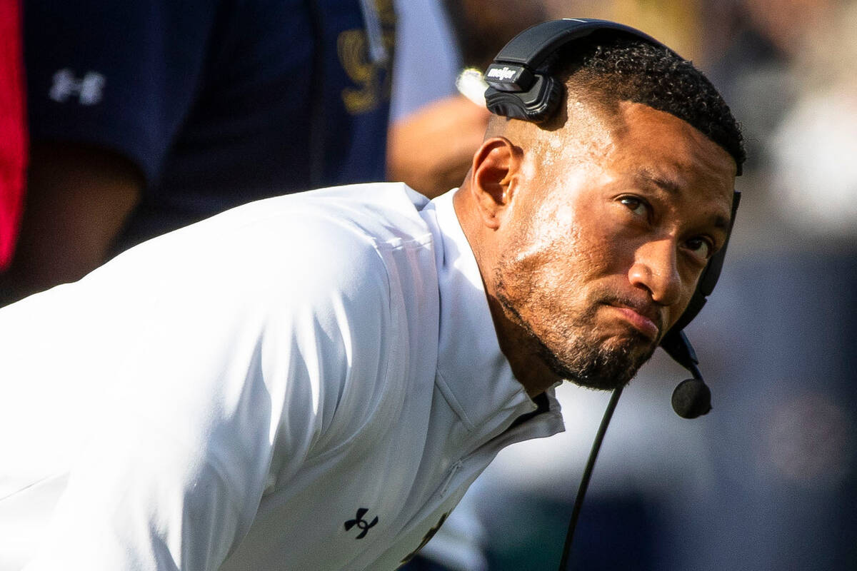 Notre Dame head coach Marcus Freeman looks to the scoreboard during the second half of an NCAA ...