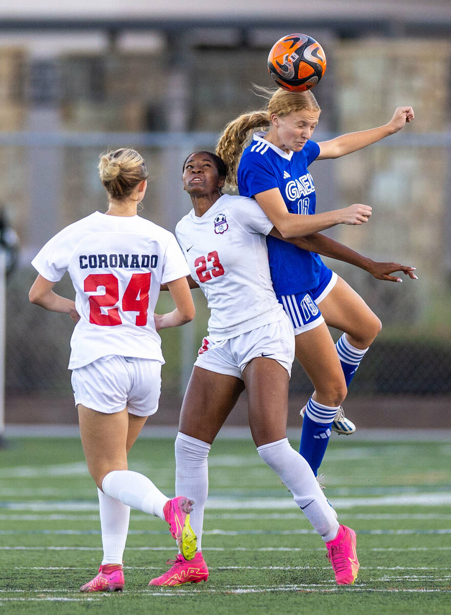 Bishop Gorman defender Grace Yager (18) heads the ball away from a Coronado player during the f ...