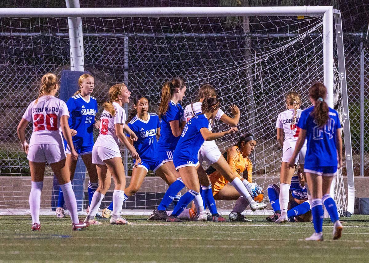 Coronado players battle with Bishop Gorman about the net on a corner kick during the second hal ...