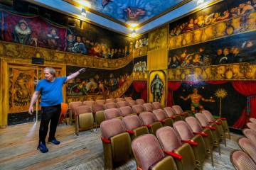 Fred Conboy points out some of the characters painted by former owner and performer Maura Becke ...