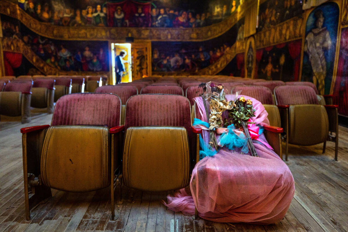 A chair for former owner and performer Maura Becket is covered with flowers in her honor within ...
