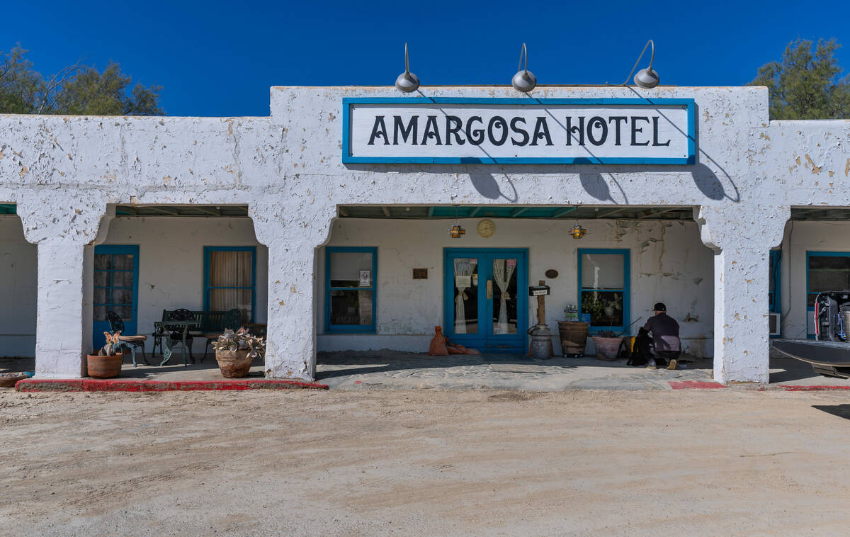 Exterior of the Amargosa Opera House and Hotel with dried mud covering the parking lot from rai ...