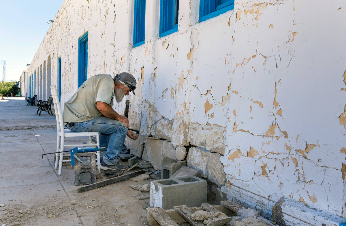 Handyman Jesse Cox works to rebuild an exterior wall of the 100-year-old Amargosa Hotel which s ...