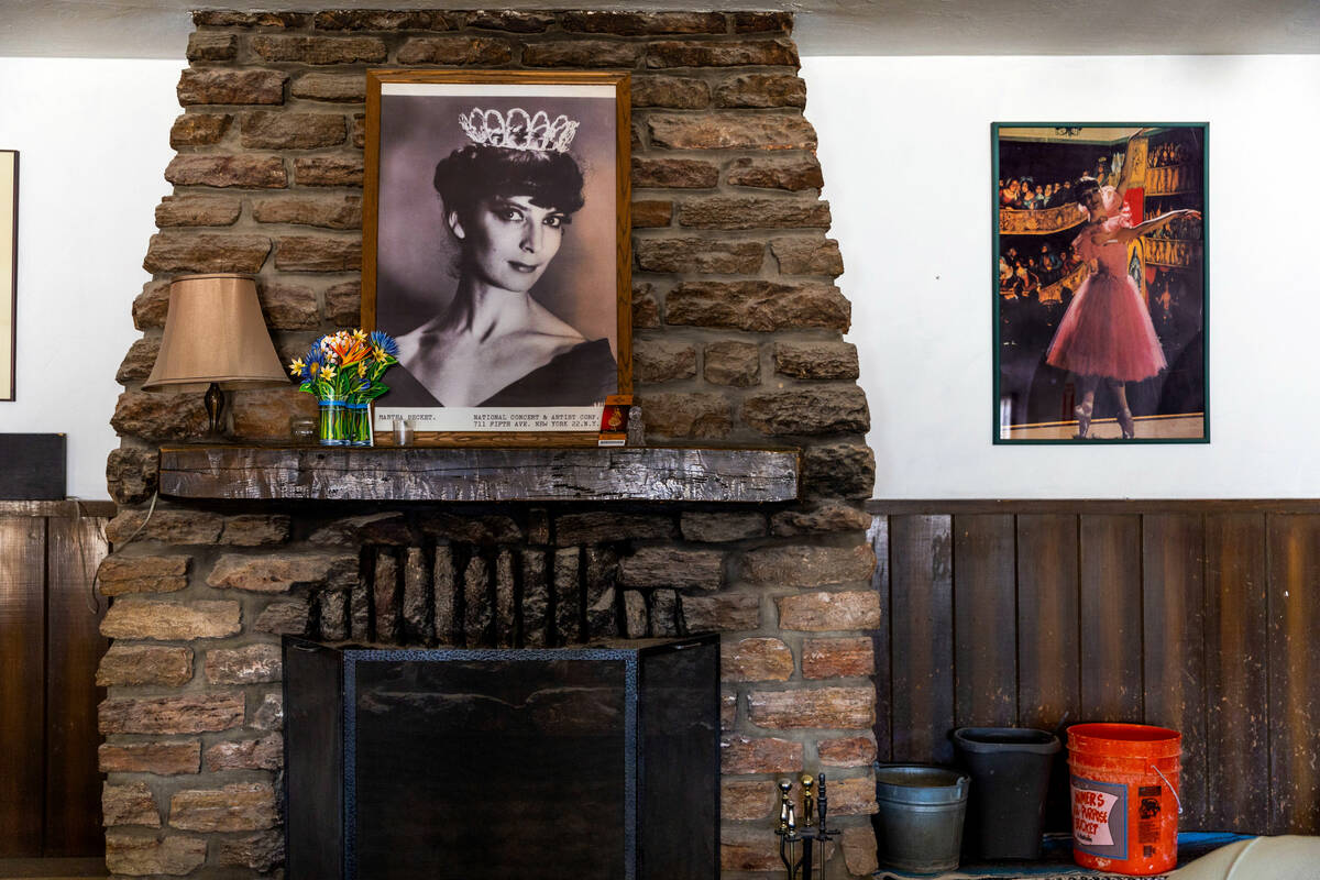 Photos of former owner Marta Becket rest on the mantlepiece and hang on a nearby wall in the Am ...