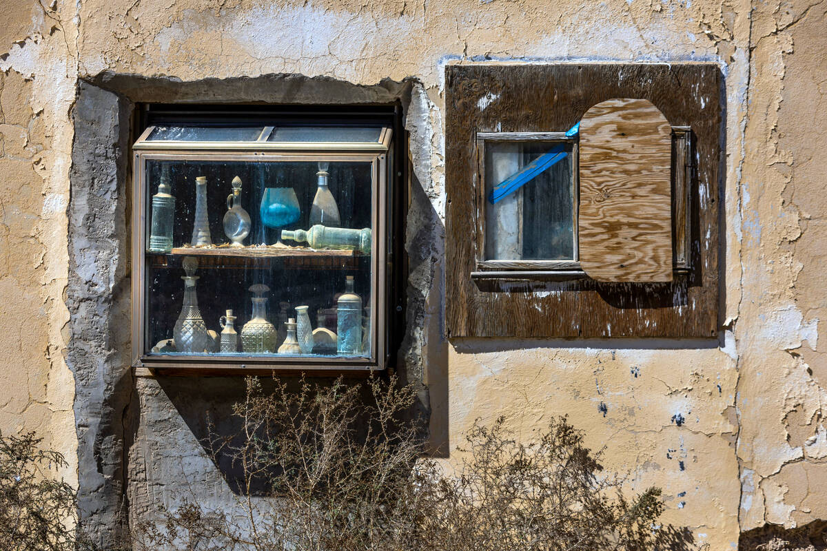 Old bottles line a window shelf inside the former Amargosa Cafe, the opera house and hotel atta ...
