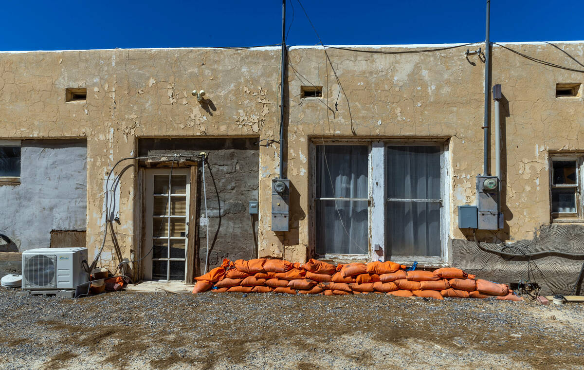 Sandbags still line a wall behind the former Amargosa Cafe in place from recent rains delivered ...