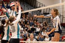 Coronado’s Rachel Purser (9) spikes while Silverado’s Isabella Hemingway (14) and ...