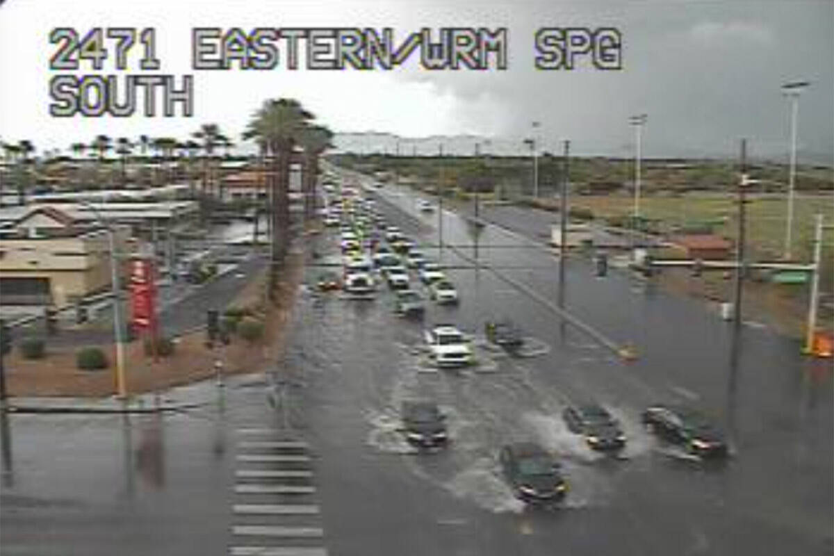 The intersection of Eastern Avenue and Warm Springs Road floods around 4:30 p.m. on Wednesday, ...
