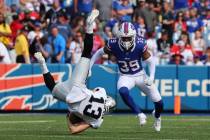 Buffalo Bills cornerback Cam Lewis (39) watches as Las Vegas Raiders' Hunter Renfrow (13) falls ...