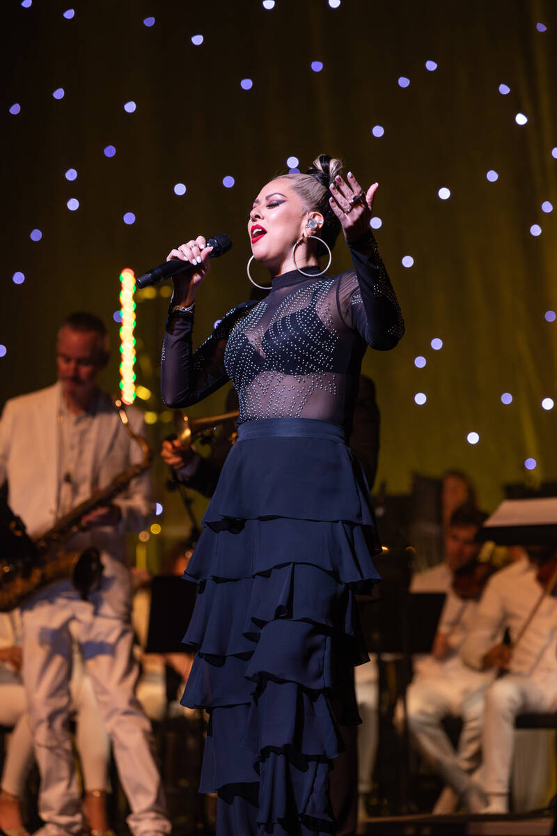 Rockie Brown is shown singing with David Perrico's Pop Symphonic orchestra at Reynolds Hall at ...