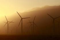 A windmill farm is seen in front of smoke from the Lake Fire in the San Bernardino National For ...