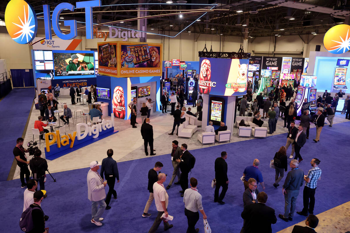 Conventioneers walk through the International Game Technology display during G2E at The Venetia ...