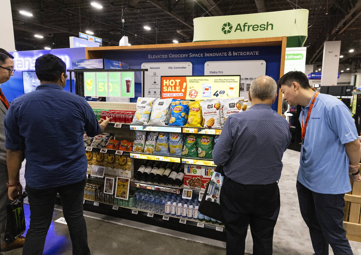 Potential customers discuss with Afresh representatives during Grocery Convention at Mandalay B ...
