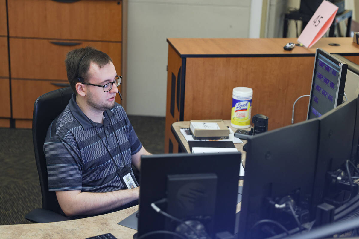 Call taker Kevin Mette answers calls at Metro’s dispatch center in Las Vegas, Wednesday, ...