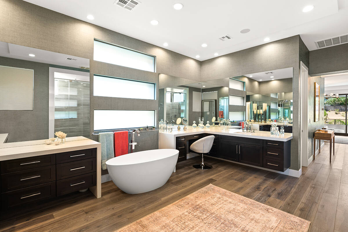 IS Luxury The upstairs primary suite features a separate sitting room and a private balcony. Th ...