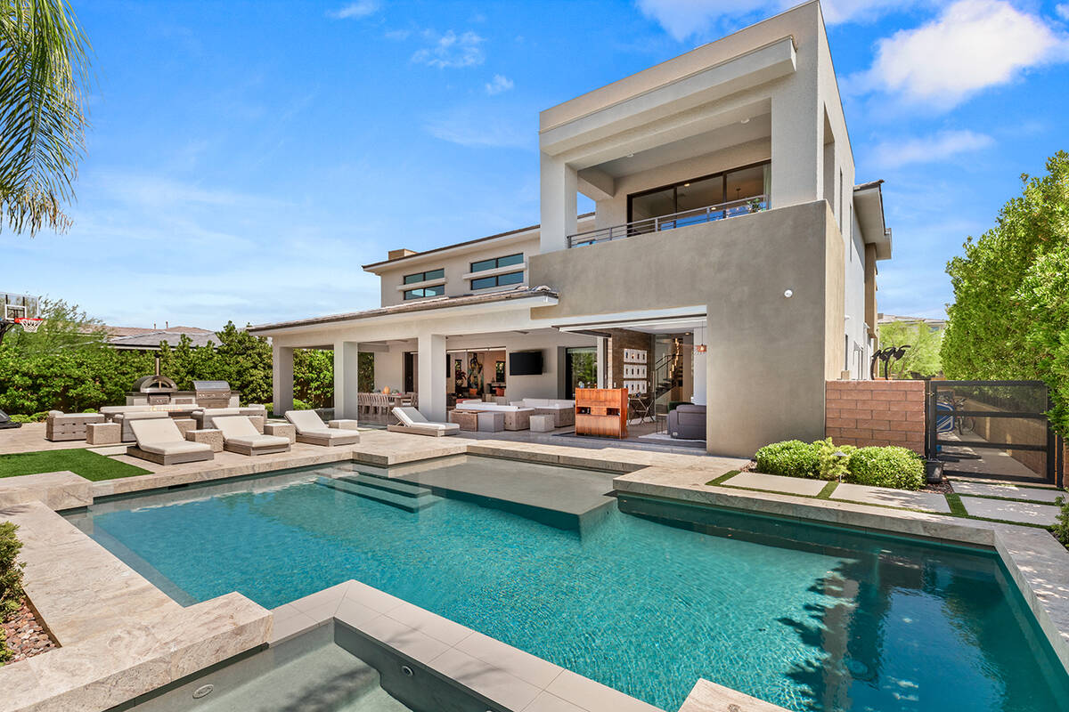 IS Luxury The 4,619-square-foot home is behind a double gate in the Silver Ridge neighborhood, ...