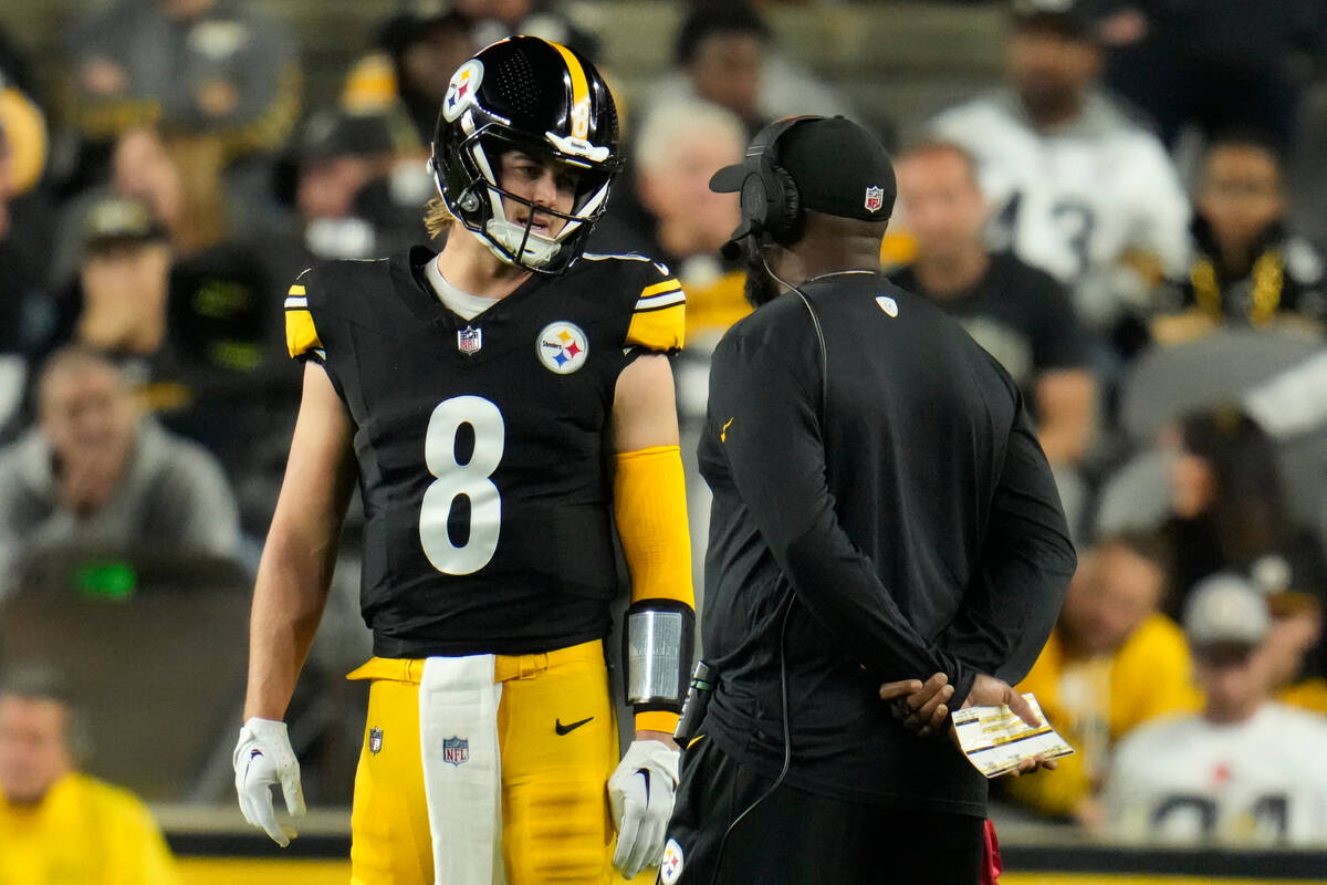 Pittsburgh Steelers quarterback Kenny Pickett (8) talks with head coach Mike Tomlin during an N ...