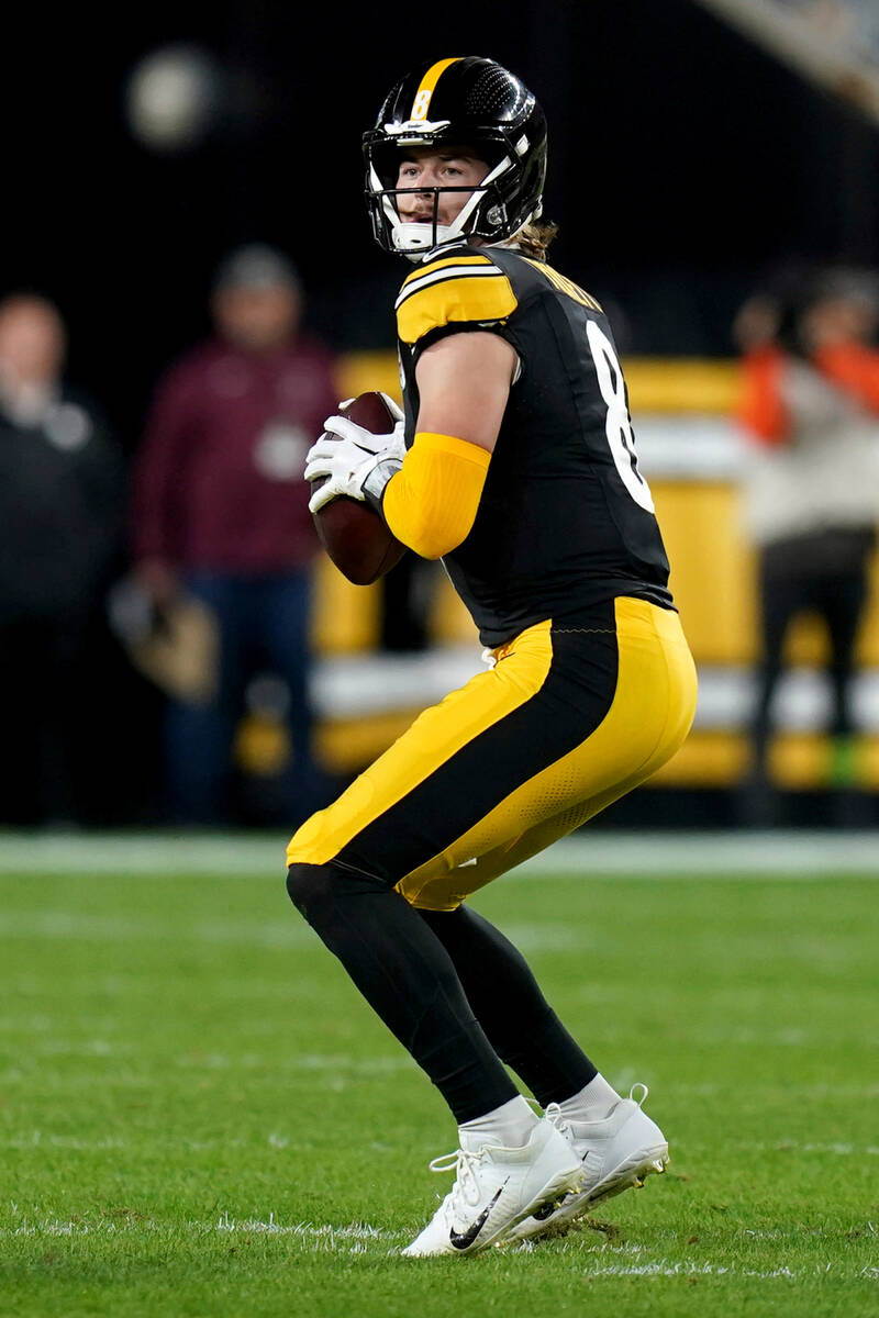 Pittsburgh Steelers quarterback Kenny Pickett drops back to pass against the Cleveland Browns i ...