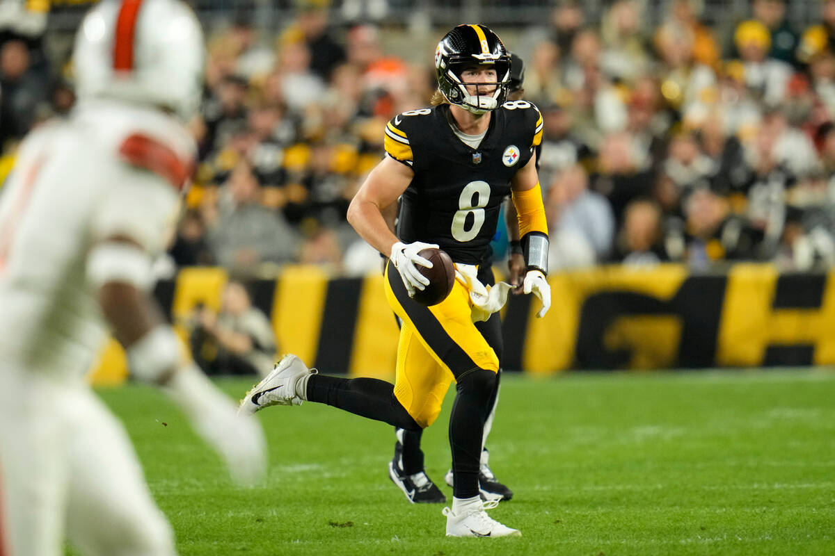 Pittsburgh Steelers quarterback Kenny Pickett (8) rolls out during an NFL football game against ...