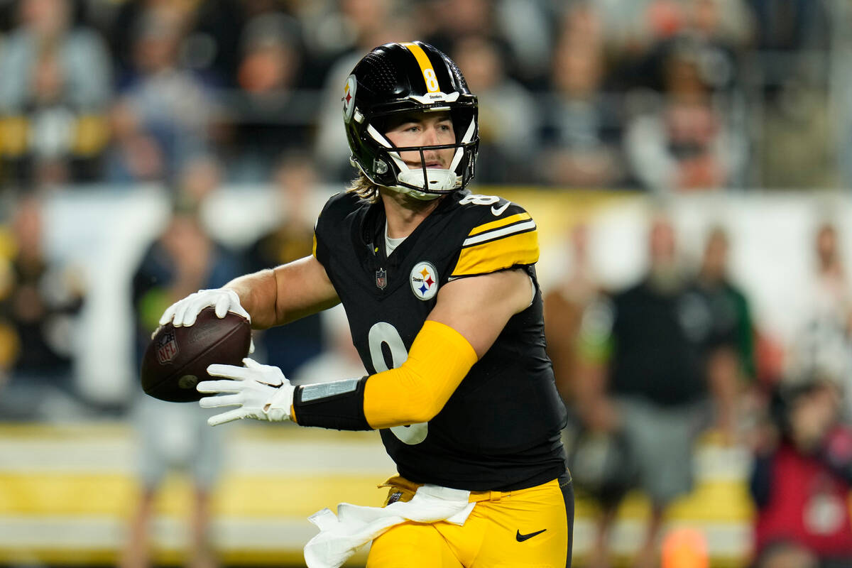 Pittsburgh Steelers quarterback Kenny Pickett looks to pass during an NFL football game against ...