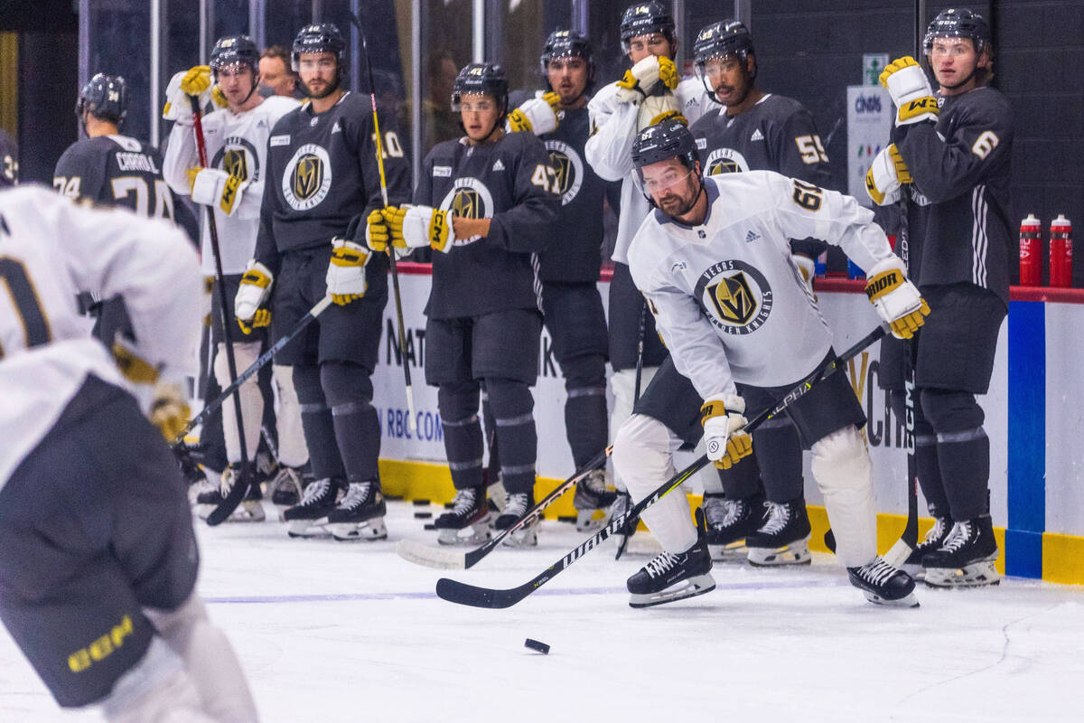 Golden Knights right wing Mark Stone (61) looks to pass the puck during their first training ca ...