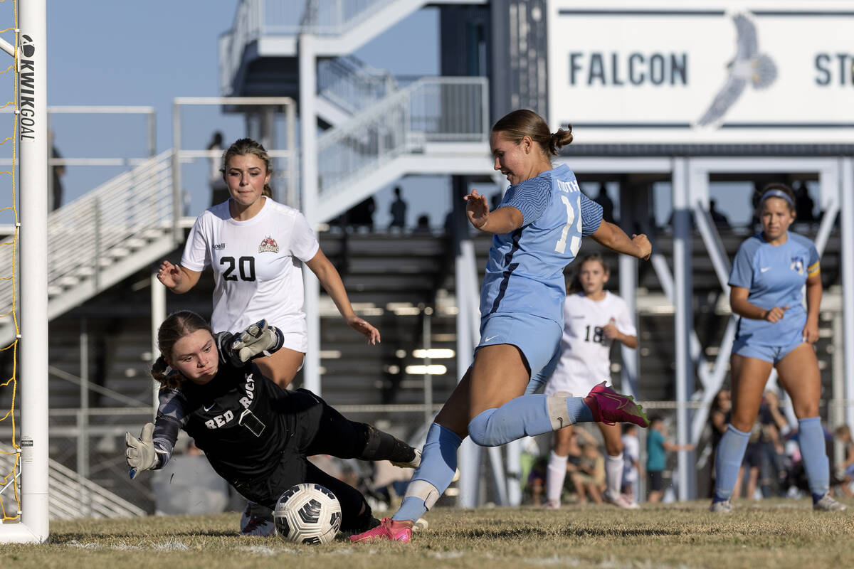 Doral goalkeeper Kenadie Mashore (1) dives to make a save against Foothill midfielder Raquel Pa ...