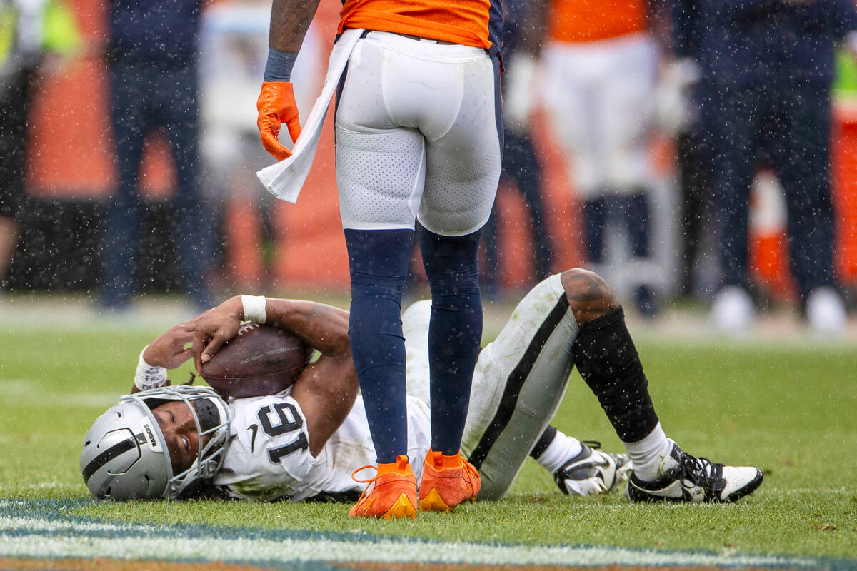 Raiders wide receiver Jakobi Meyers (16) holds onto the football after being concussed followin ...