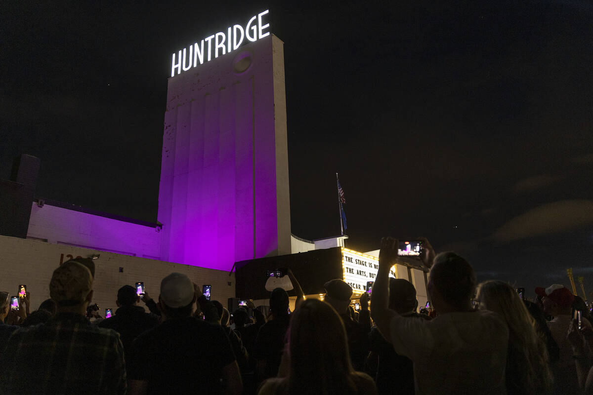 A crowd photographs as the Huntridge Theater marquee is lit on Friday, April 7, 2023, in Las Ve ...