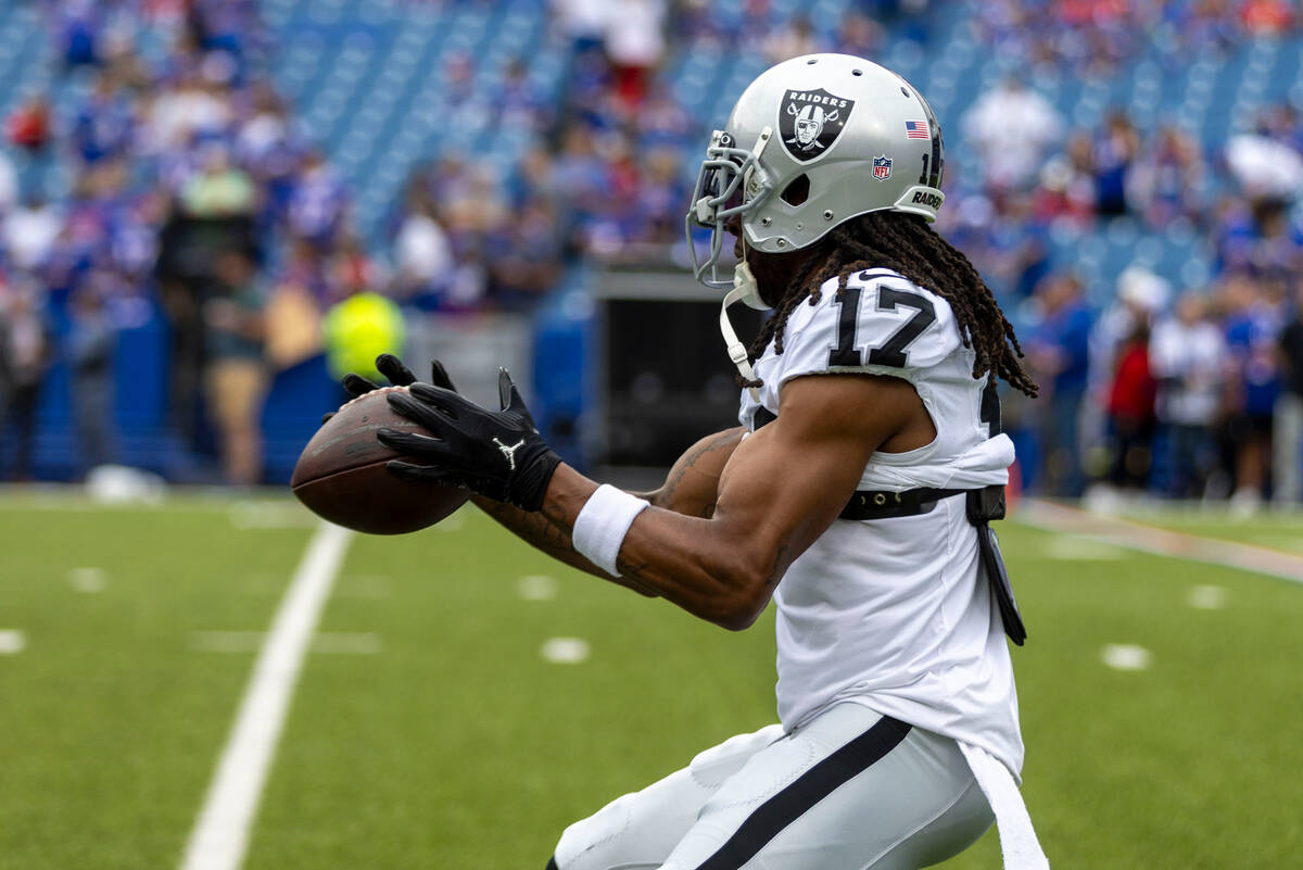Raiders wide receiver Davante Adams (17) makes a catch before an NFL game against the Buffalo B ...