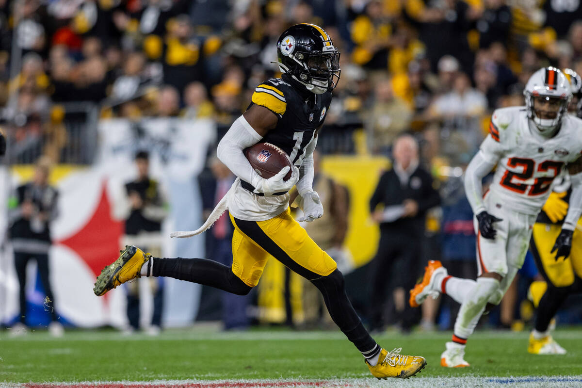 Pittsburgh Steelers wide receiver George Pickens (14) runs after the catch for a 71 yard touchd ...