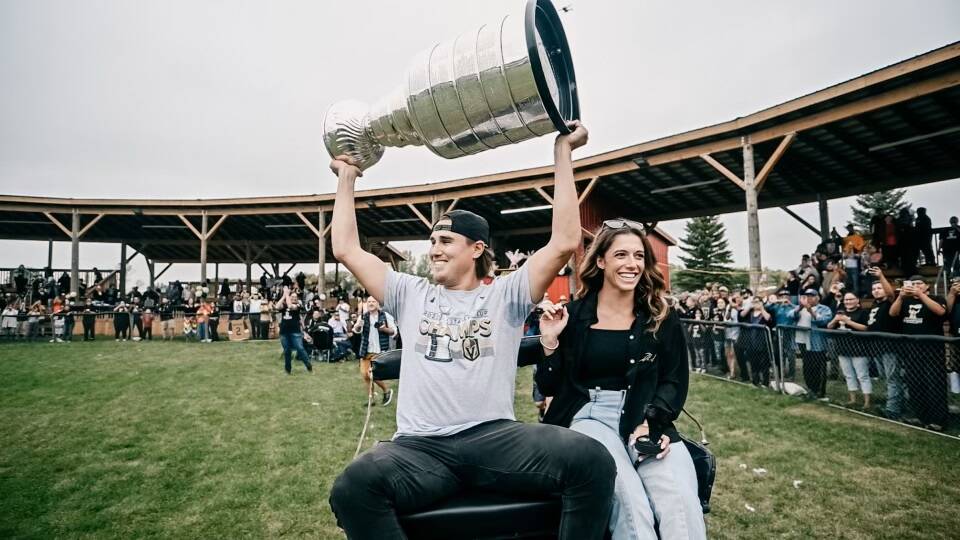 Golden Knights defenseman Zach Whitecloud shows off the Stanley Cup during a visit to the Sioux ...