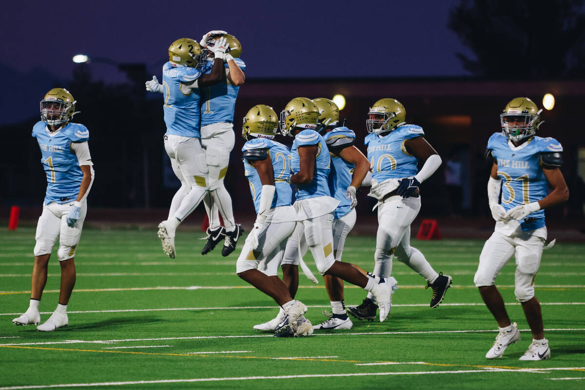Foothill players celebrate an interception during a game against Las Vegas at Foothill High Sch ...