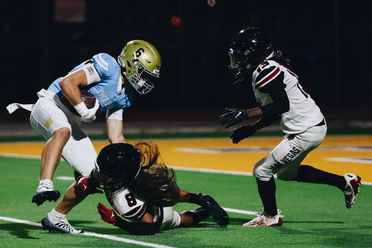 Foothill wide receiver Ethan Stubbs (6) runs the ball as he avoids Las Vegas strong safety Kawi ...