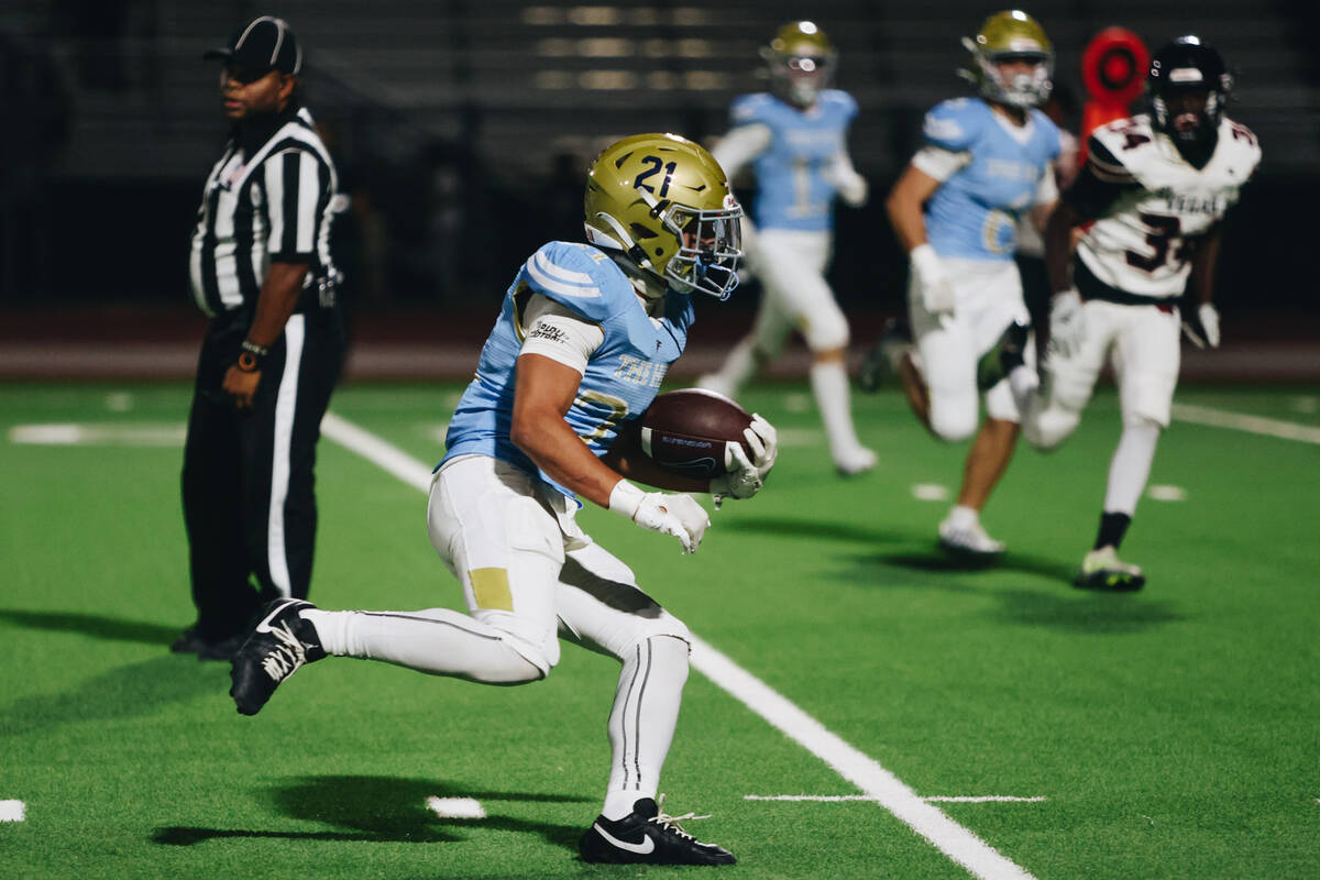 Foothill running back Avant Gates Jr. carries the ball down the field during a game against Las ...