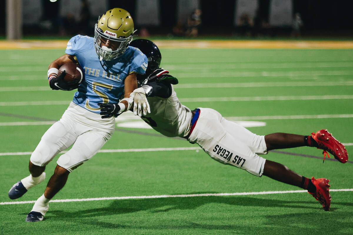 Foothill wide reciever Chase Kennedy escapes a Las Vegas defender during a game at Foothill Hig ...