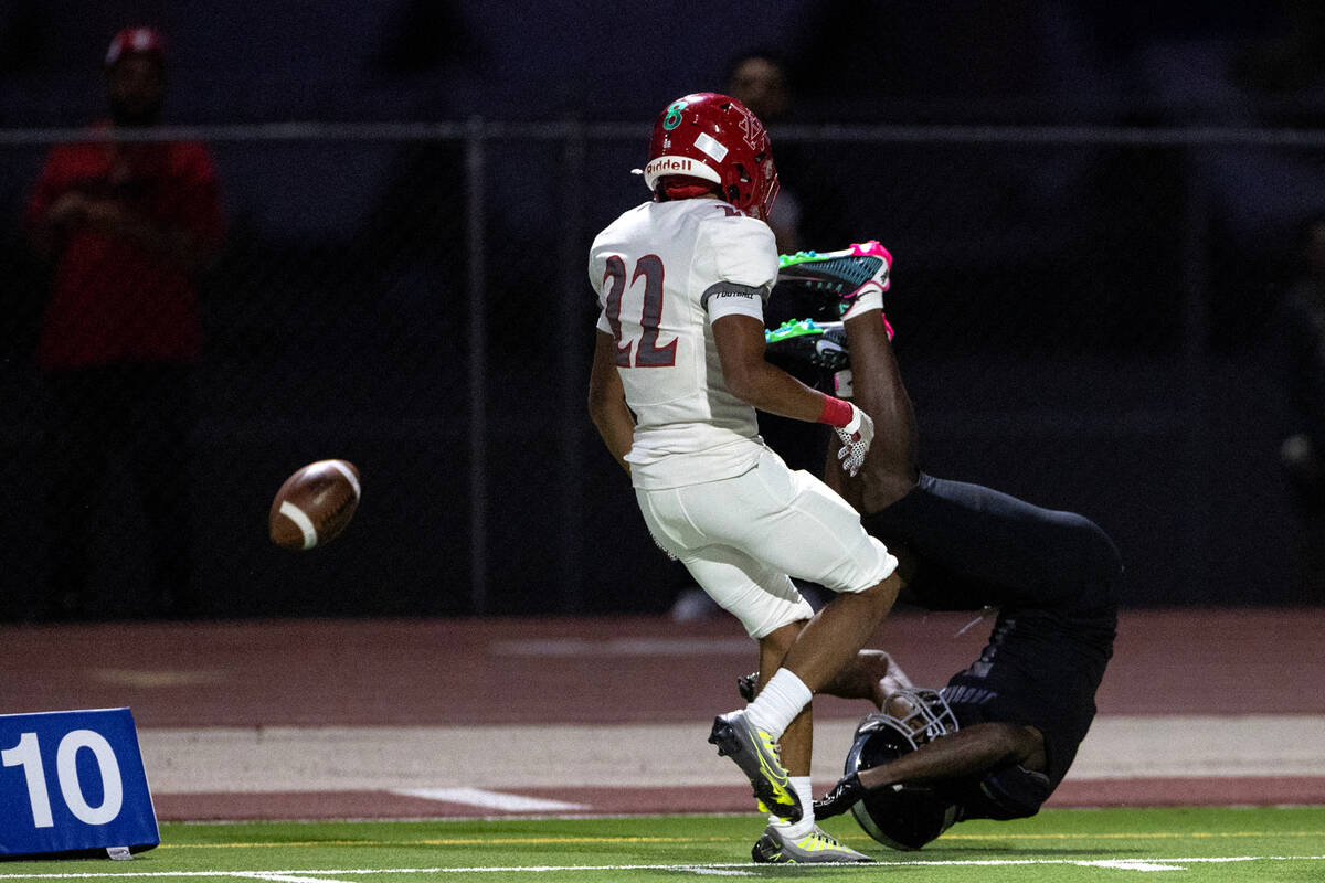 Arbor View cornerback Adrian Peterson (22) breaks up a pass intended for Desert Pines wide rece ...