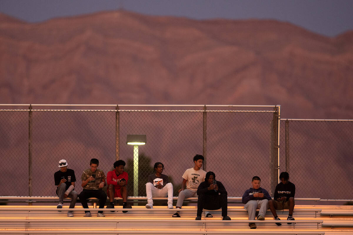 Some Arbor View fans watch the game while others watch their phone during the first half of a h ...