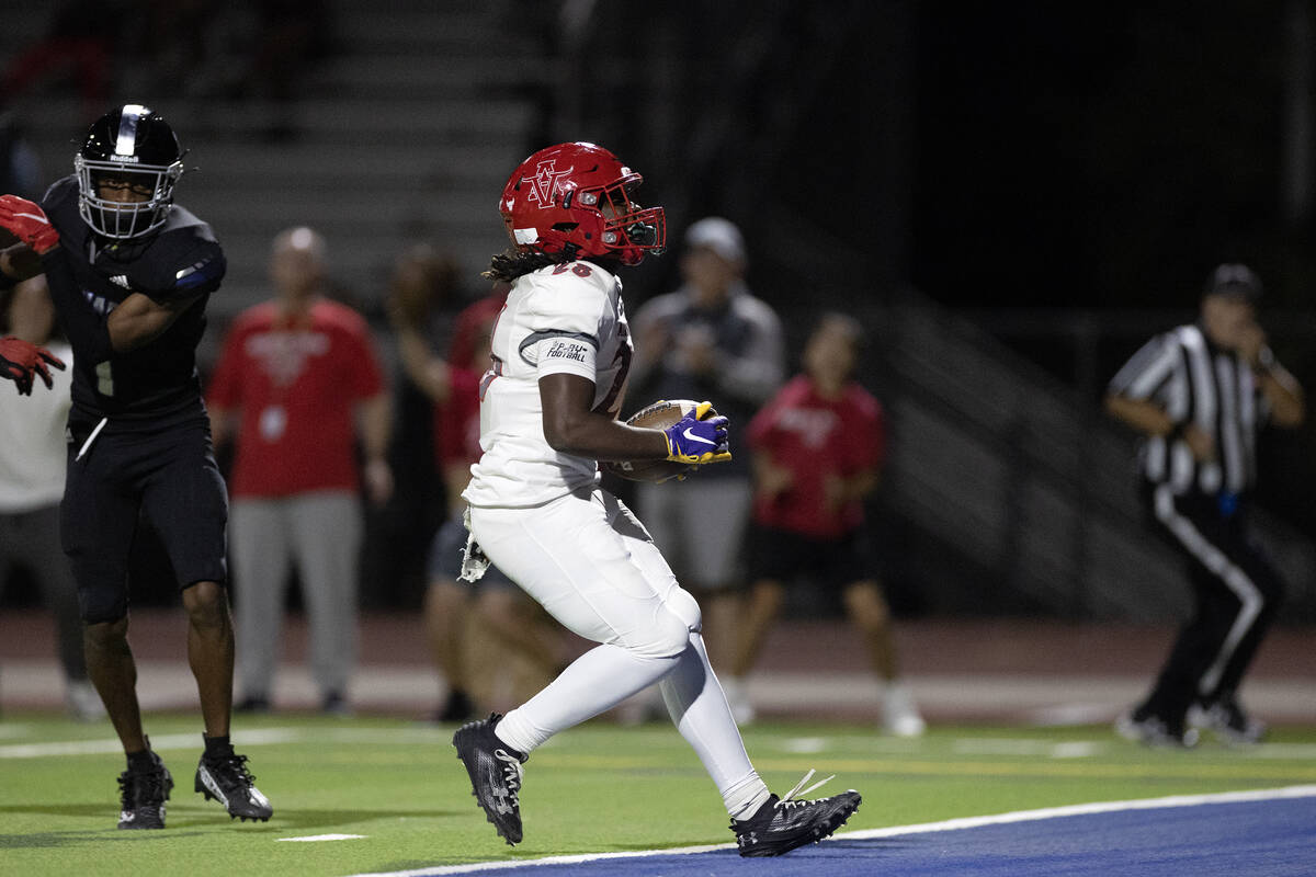 Arbor View running back Nylen Johnson (28) runs into the end zone for a touchdown while Desert ...