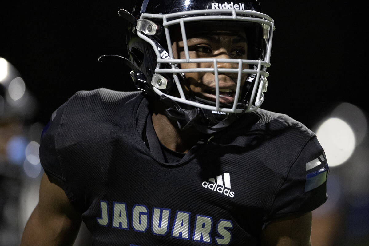 Desert Pines wide receiver Tyrik Sim'eus celebrates a successful defensive play during the seco ...