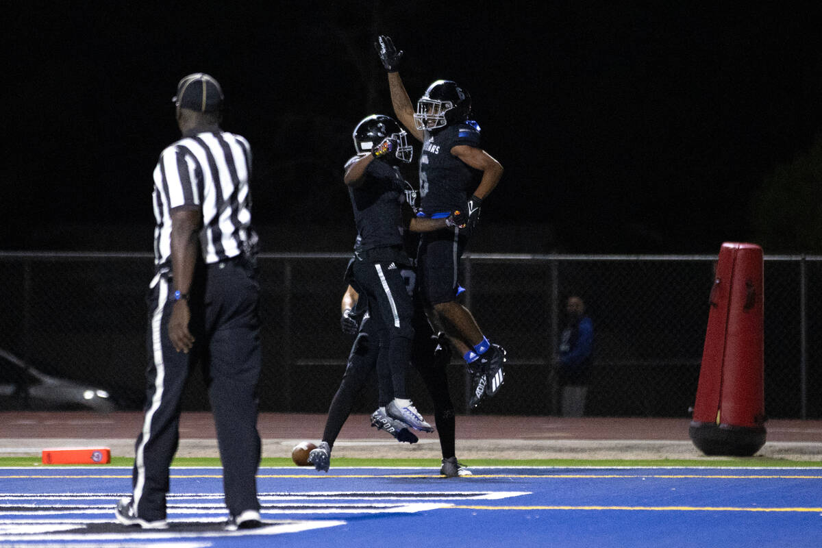 Desert Pines wide receiver Massiah Mingo (6) is congratulated on his touchdown during the secon ...