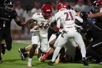 Arbor View running back Kamareion Bell (20) runs the ball during the second half of a high scho ...