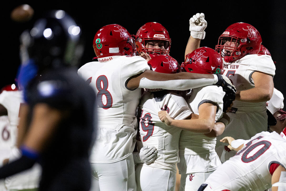 Arbor View celebrates their overtime win in a high school football game against Arbor View at D ...